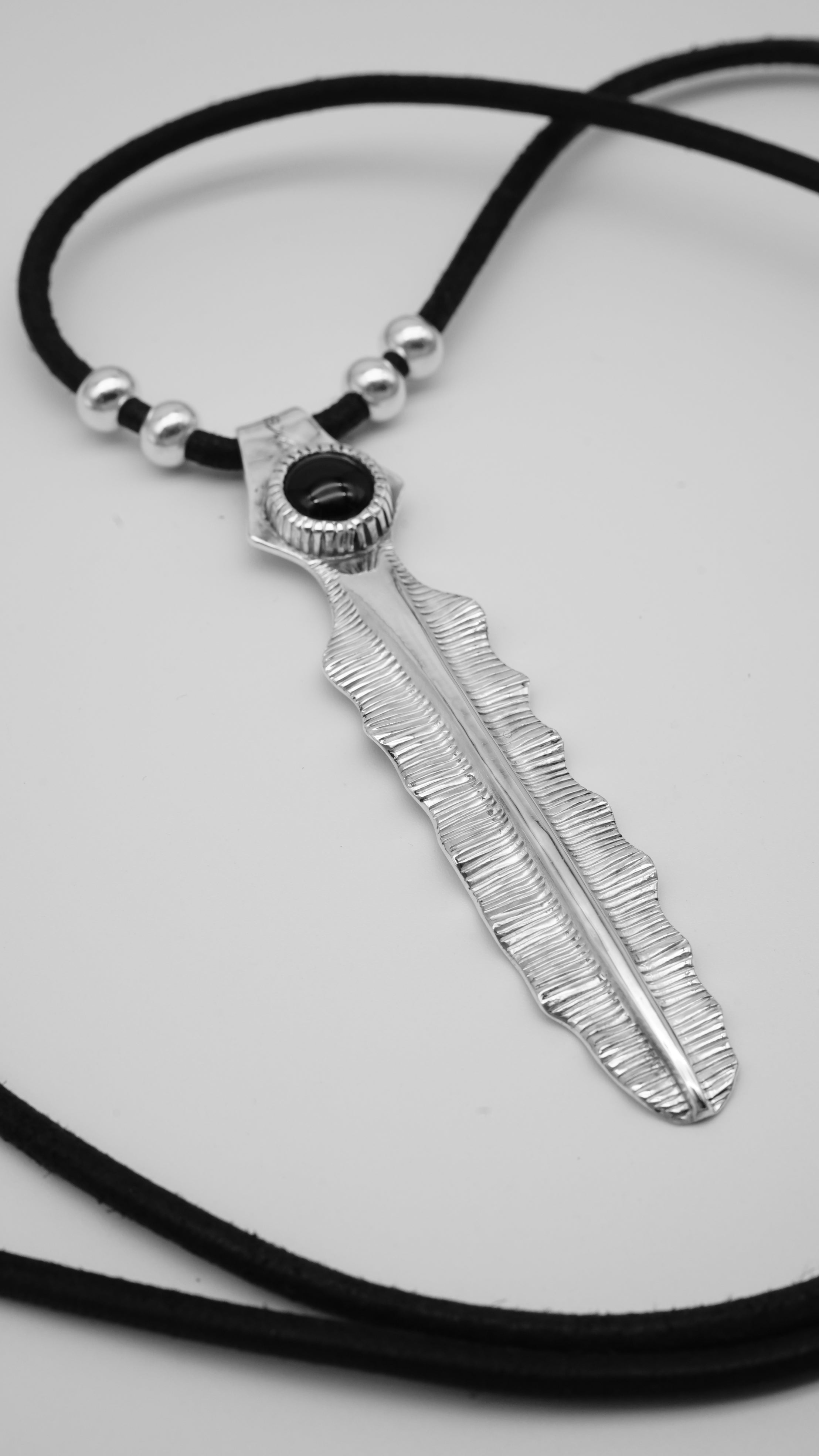 Handcrafted Sterling Silver Pendant with Black Onyx – Banana Leaf Inspired